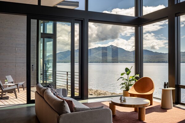 The cantilevered master bedroom and living space both feature large expanses of glass that open up panoramic views of the surrounding wild landscape.