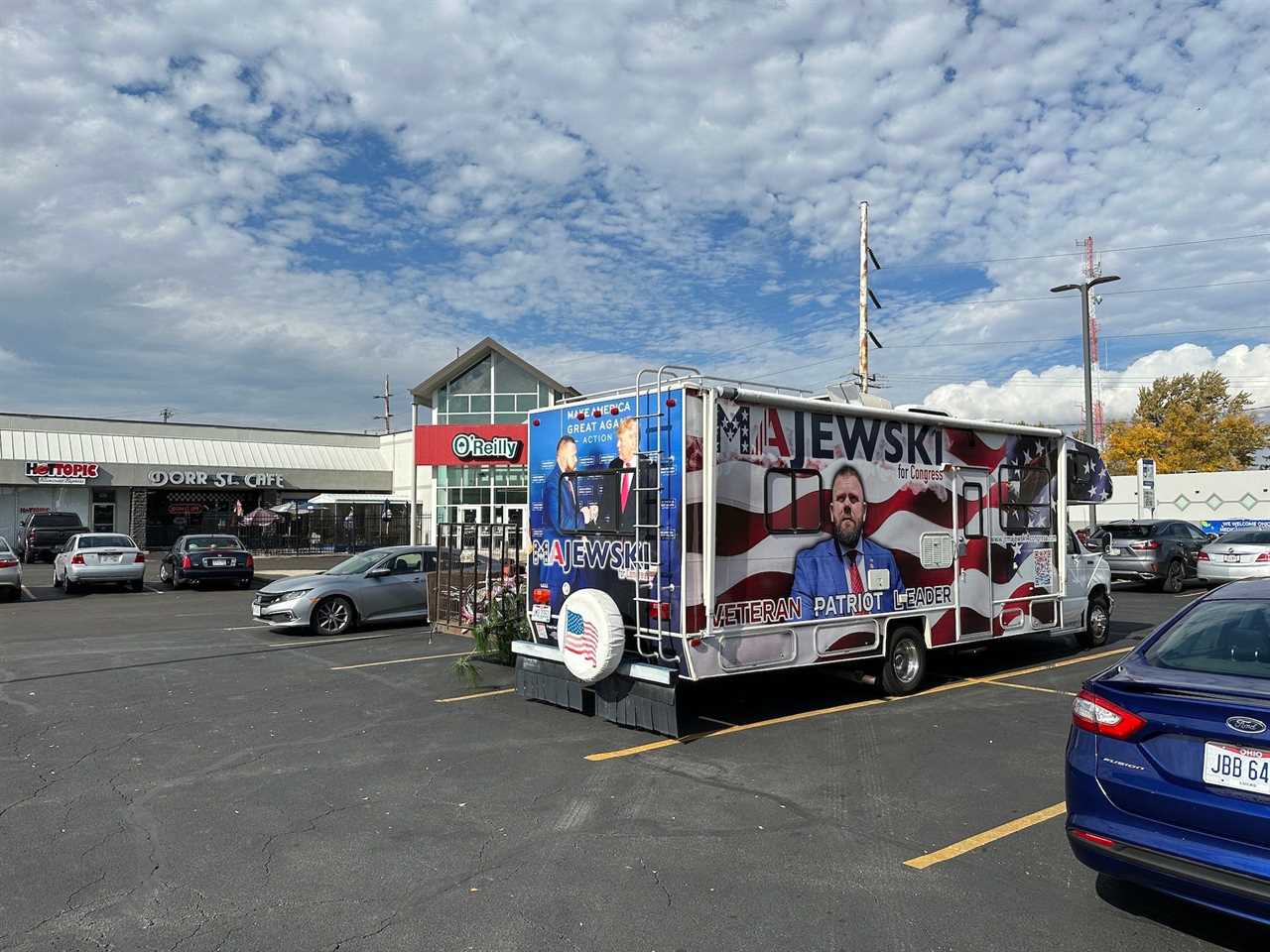 Majewski's campaign bus outside Dorr Street Cafe on October 25, 2022.