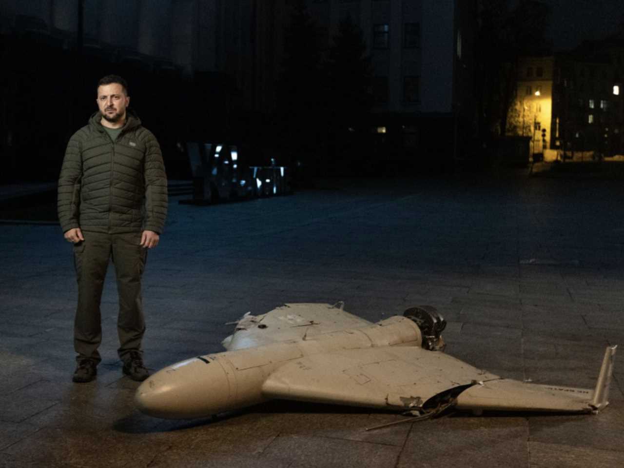 Ukrainian President Volodymyr Zelenskyy stands next to an Iranian-made Shahed-136 drone.