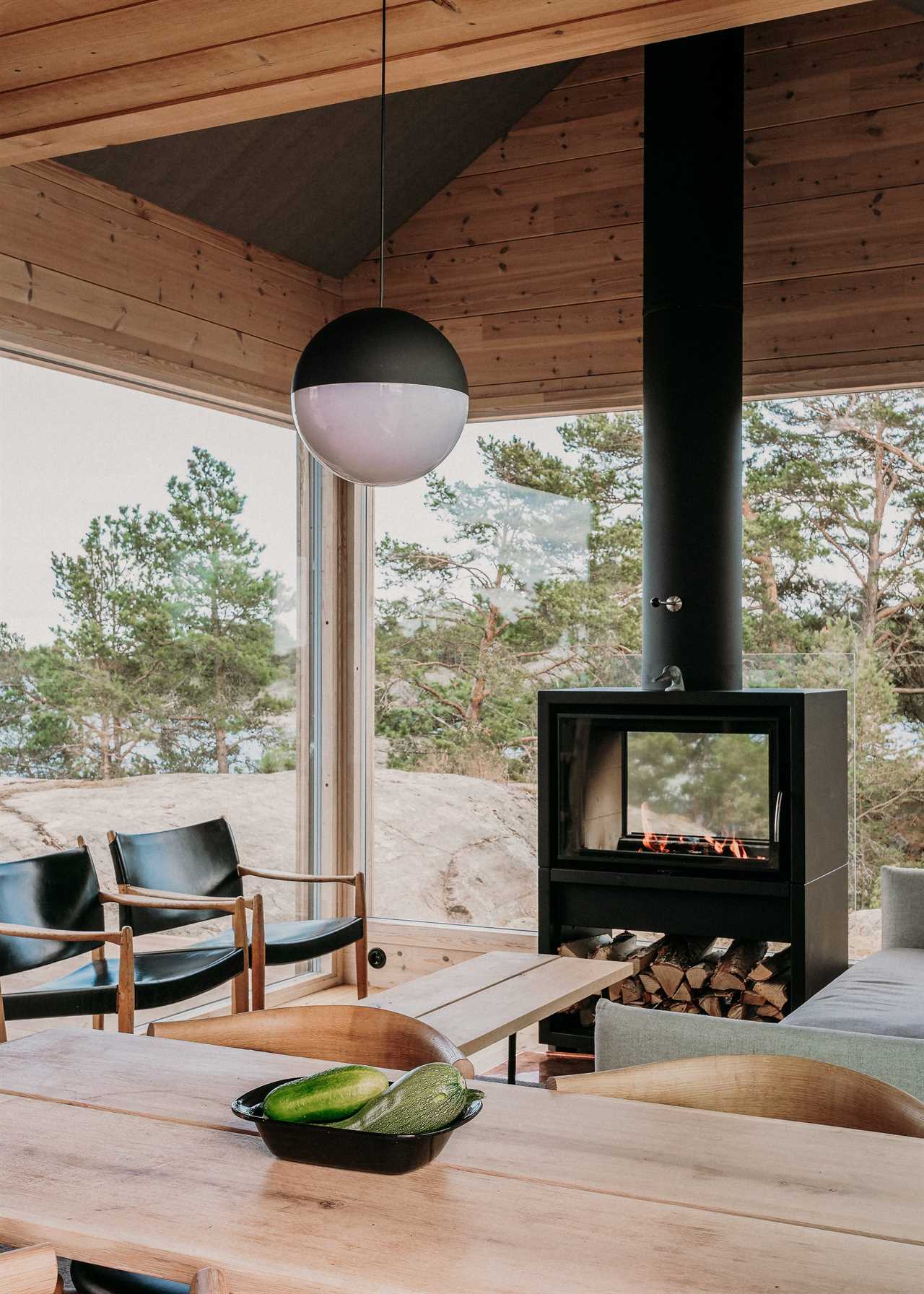 an outdoor lounge with fireplace