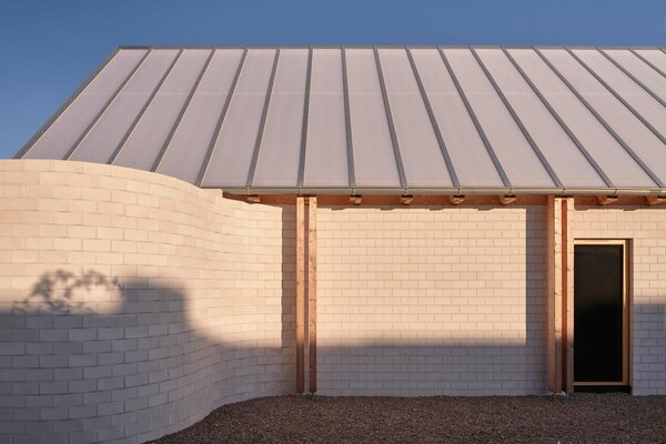 The See-Through Roof of This Brick Home Doubles as a Viewing Deck