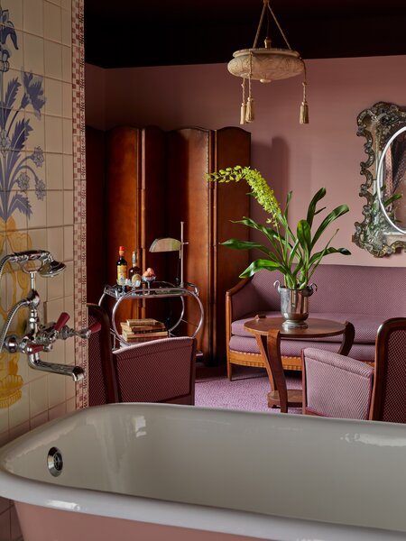 Four suites feature a clawfoot bathtub at the center of the room.