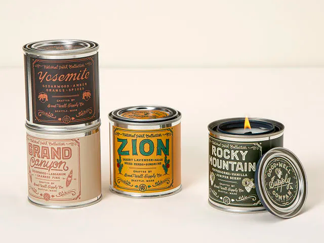 multiple national park candles in metal containers