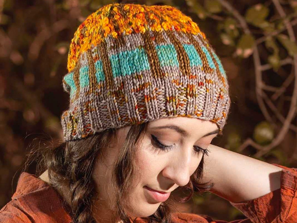 Person wearing a knitted cap based on a national park