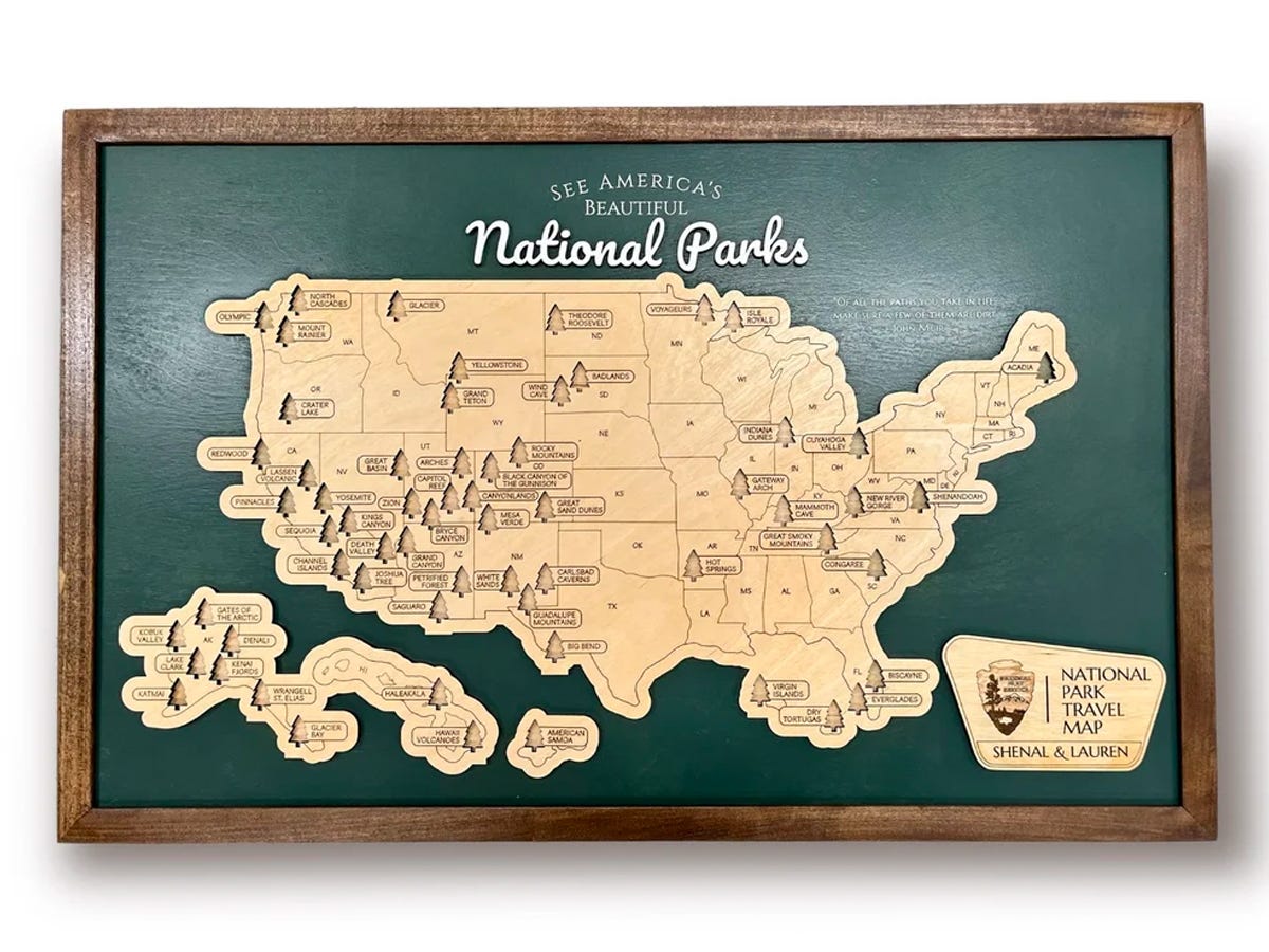 Framed wooden map of the United States to track travels between natural parks