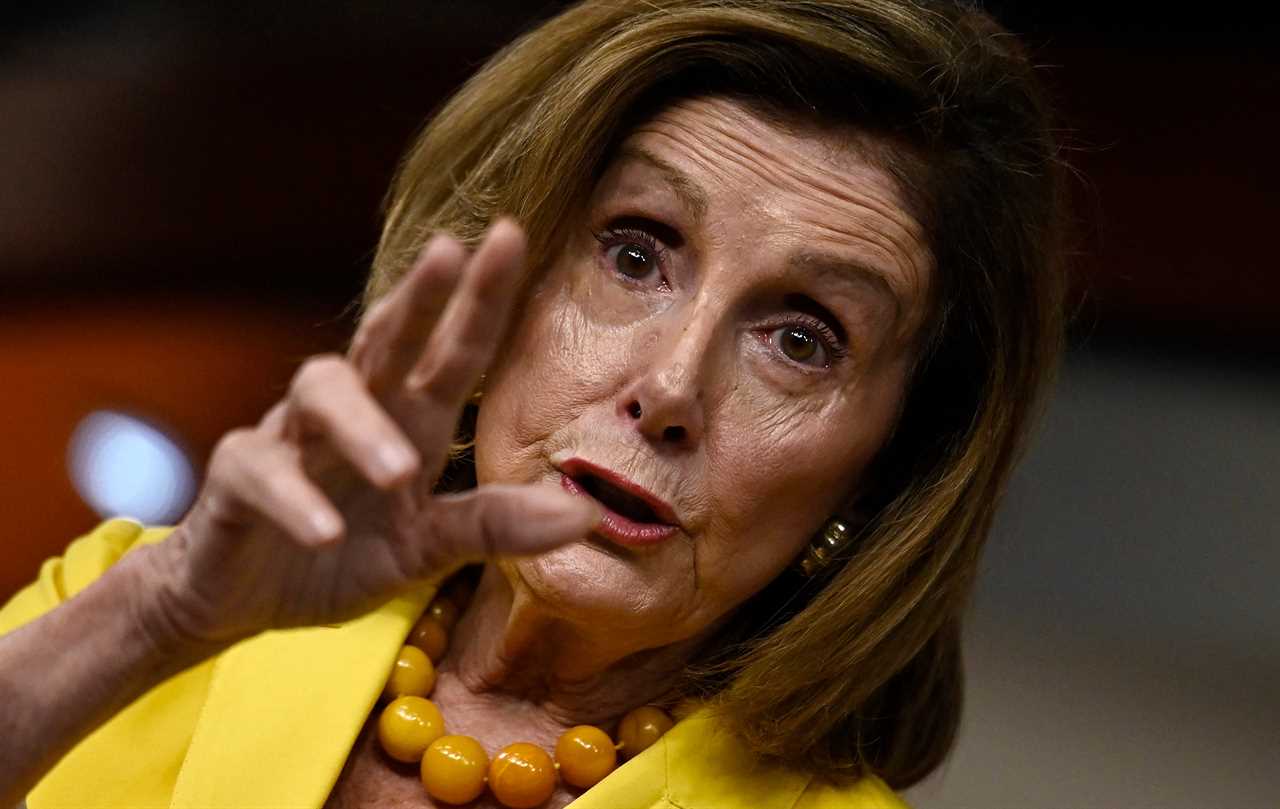 Nancy Pelosi gestures