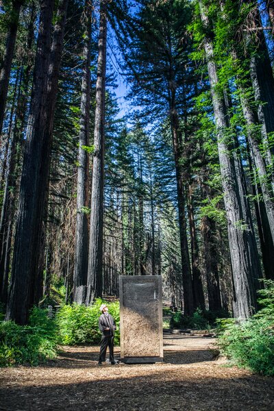 Jupe CEO and chief designer Jeff Wilson poses with The Portal in Northern California. The front facade is a large piece of two-way glass, and users can pull down a retractable screen for privacy.