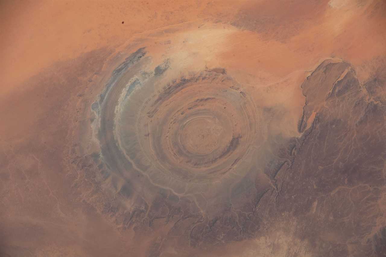 concentric circles landscape feature in red brown desert