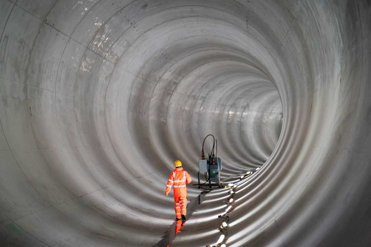 General view of a construction worker in a completed section of the main tunnel of London’s new 25-kilometer-long Thames Tideway Tunnel or 