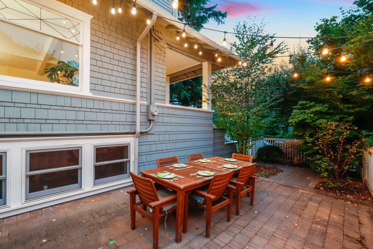 outside of a home with basement windows and table outside the basement