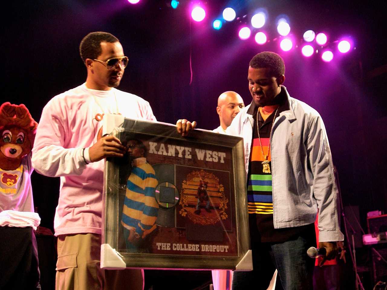 Kanye West presented with his first platinum album "The College Dropout" in 2004