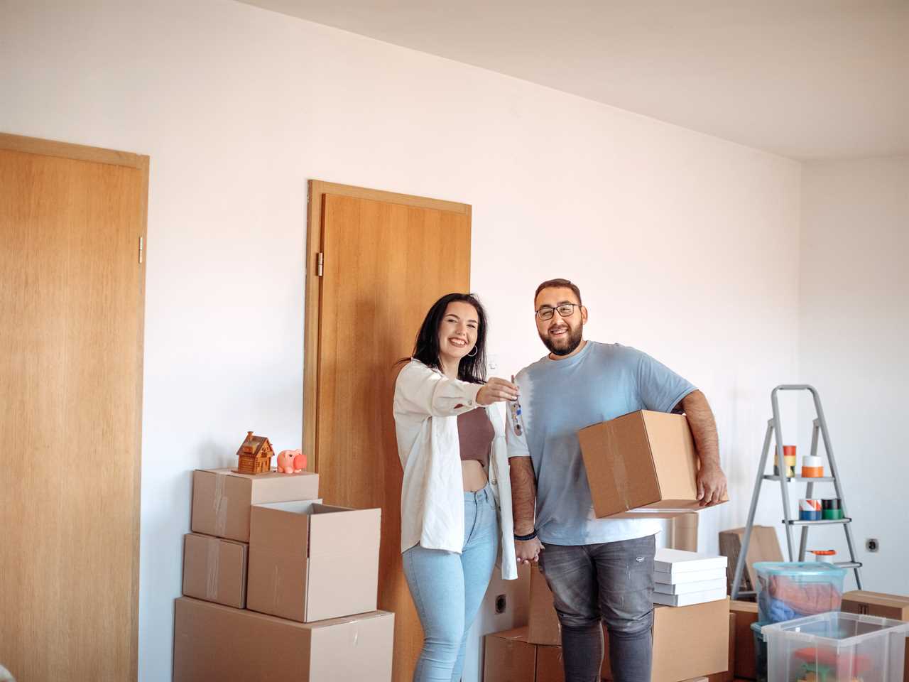 A young couple moves into their new home.