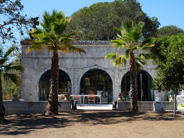 Inspired in part by the work of Swedish architect Sigurd Lewerentz, and wanting to preserve the sense of a ruin, they left the arched front windows frameless. 