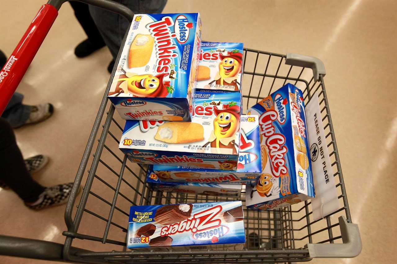 Boxes of Hostess Twinkies in a grocery-store shopping cart.