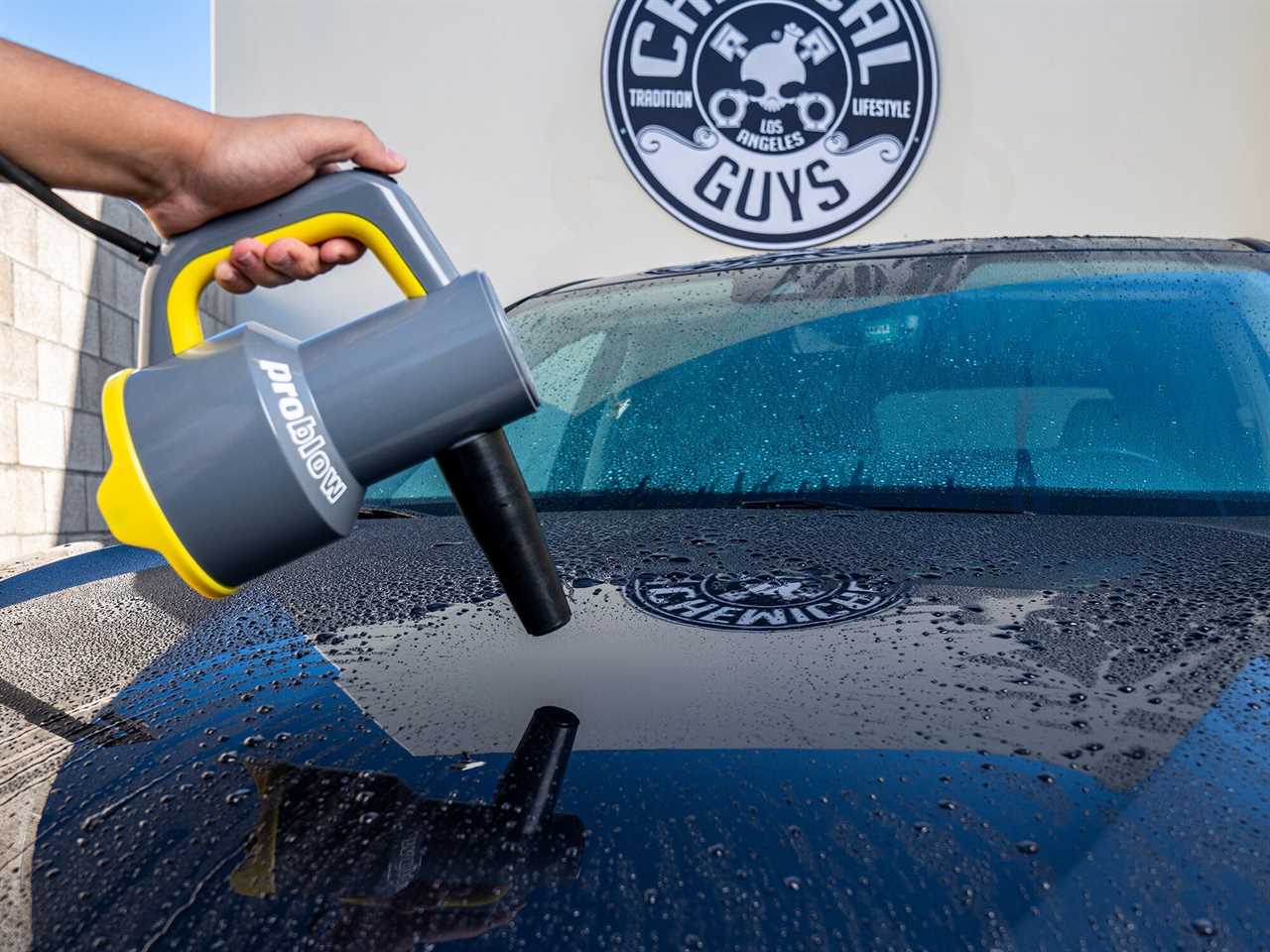 handheld pro blow dryer drying a car