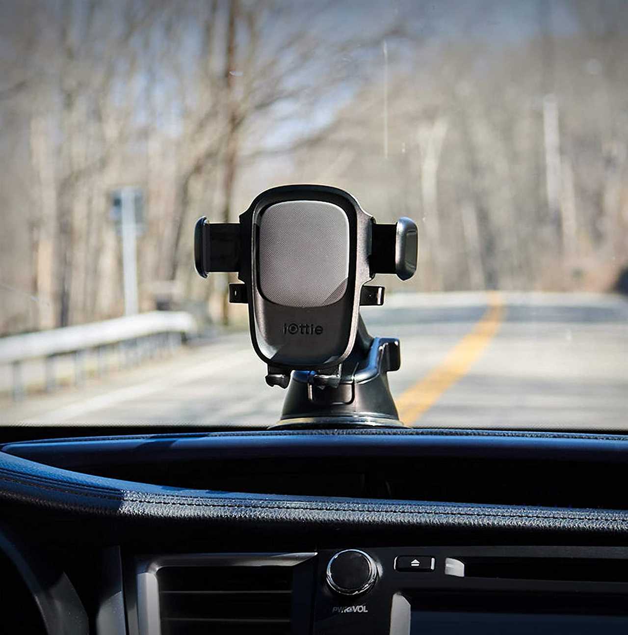 The iOttie One Touch 5 secured to the top of a dashboard.