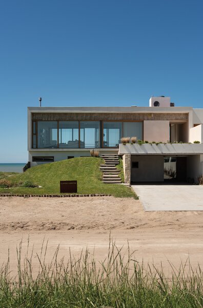 A Concrete Home on the Coast of Argentina Uses Stone to Connect Land and Sea