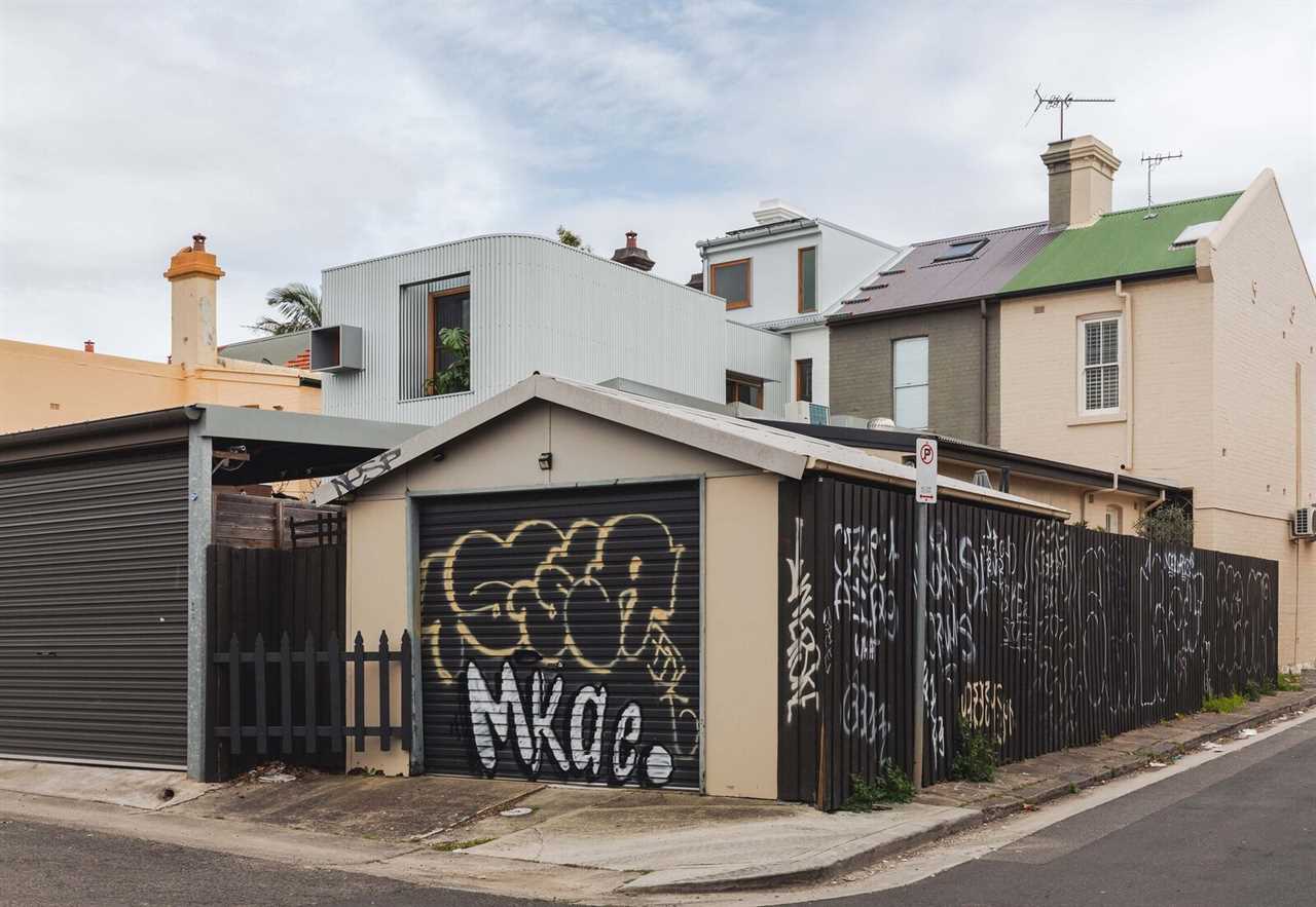 A Terrace Home’s Corrugated Steel Addition Hides Surprisingly Elegant Interiors