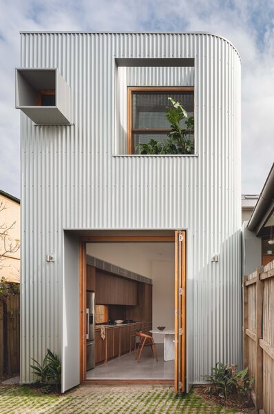 A Terrace Home’s Corrugated Steel Addition Hides Surprisingly Elegant Interiors