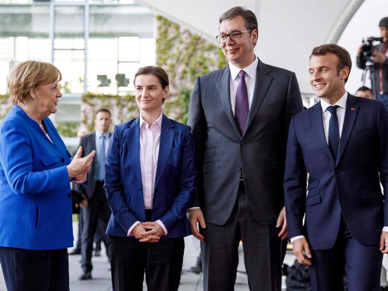 BERLIN, GERMANY - APRIL 29: German Chancellor Angela Merkel (L) and French President Emmanuel Macron (R) greet Serbian President Aleksandar Vucic (2nd R) and Serbian Prime Minister Ana Brnabic (2ndL) upon their arrival at the Chancellery for the Western Balkans Conference on April 29, 2019 in Berlin, Germany. German Chancellor Angela Merkel and French President Emmanuel Macron are hosting the conference that includes the leaders of North Macedonia, Albania, Croatia, Bosnia-Herzegovina, Serbia, Kosovo, Montenegro and Slovenia. (Photo by Carsten Koall/Getty Images)