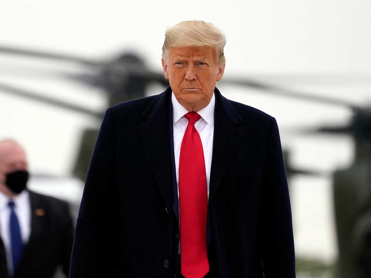 President Donald Trump boards Air Force One upon arrival at Valley International Airport, Tuesday, Jan. 12, 2021, in Harlingen, Texas, after visiting a section of the border wall with Mexico in Alamo, Texas.