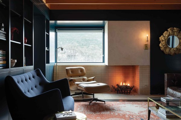 Firebrick lines both the wall and floor so that the fire can be lit right on the ground for an ultra-cozy night in.