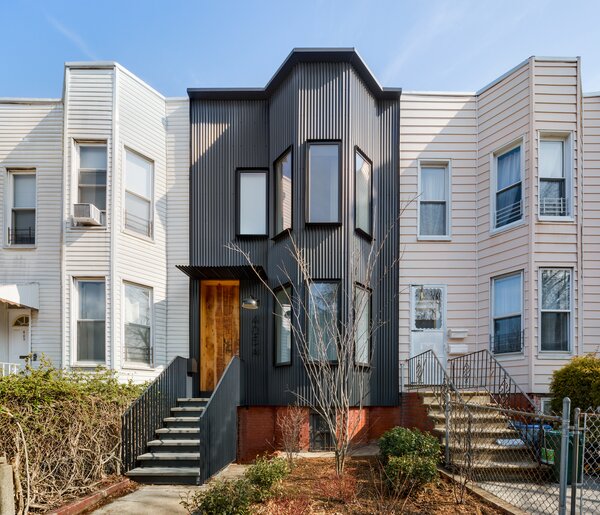 Bay windows are common in this kind of terraced house and add visual interest to both the house and the street, as well as a small amount of additional interior space. 