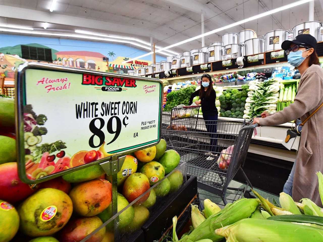 People grocery shopping in Rosemead, California on April 21, 2022.