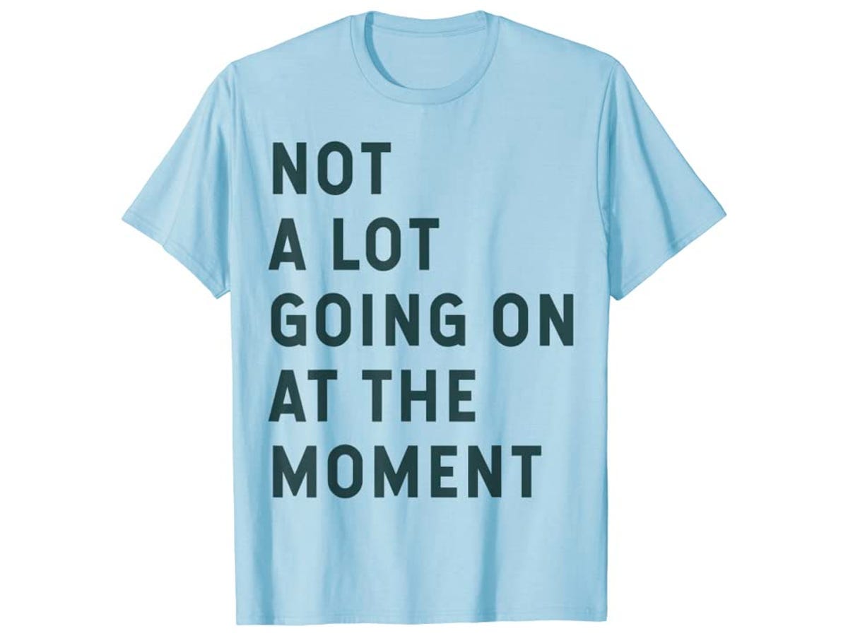 Light blue T-shirt with text of "Not a lot going on at the moment" printed on it, referencing Taylor Swift’s “22” music video.