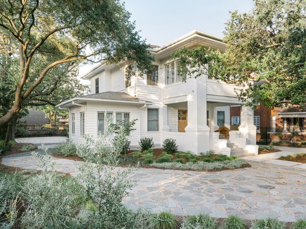 HR Design Department refurbished the original wood siding and painted it in Sherwin Williams Snowbound. New flagstone pavers and gravel make the yard more drought tolerant.