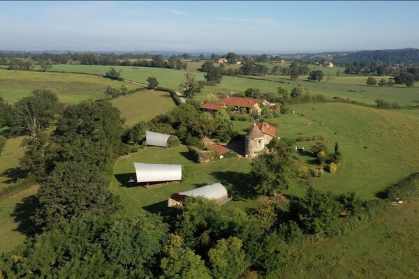 An aerial view of the French compound, located on the banks of the Loire in Iguerande. The property is home to the award-winning restaurant and hotel La Colline du Colombier, which was established in 2008. Soon thereafter, the family owners joined forces with architect Patrick Bouchain to revive the rural complex, including the multiple buildings included.