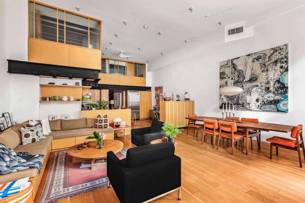 Refinished oak flooring runs throughout, connecting the main living spaces on the first floor.