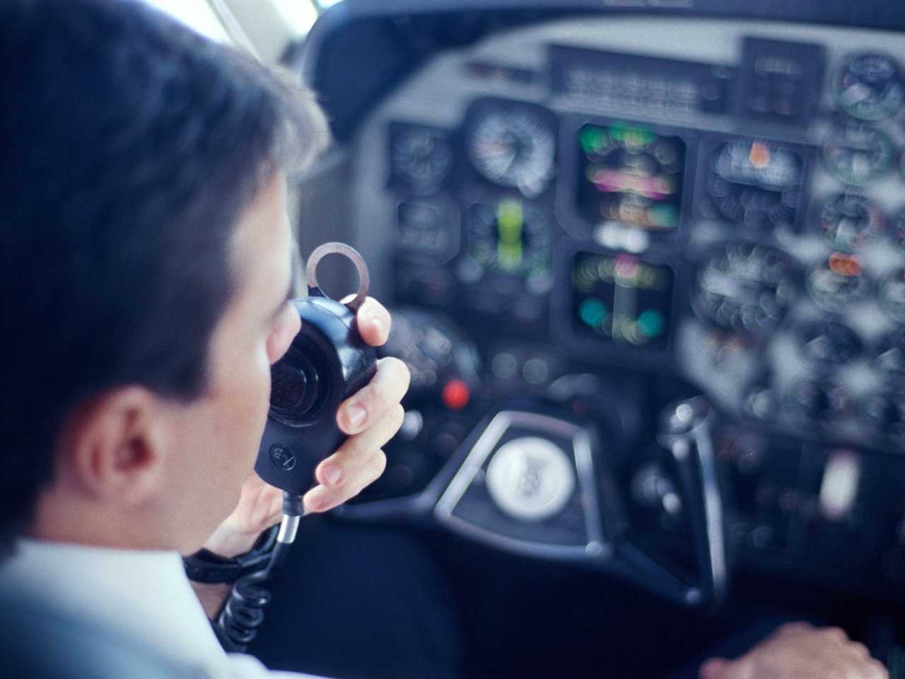 Airline pilot talking into a radio