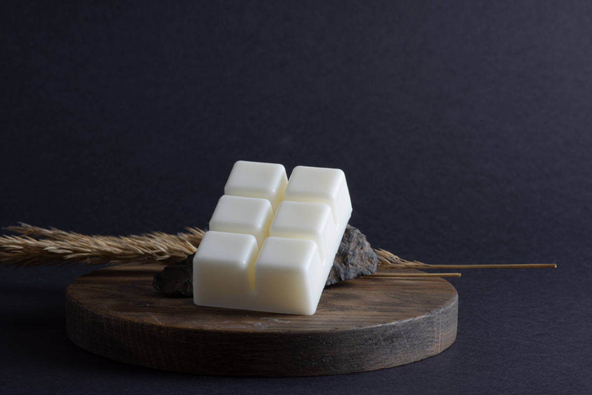 A white wax melt on a tray