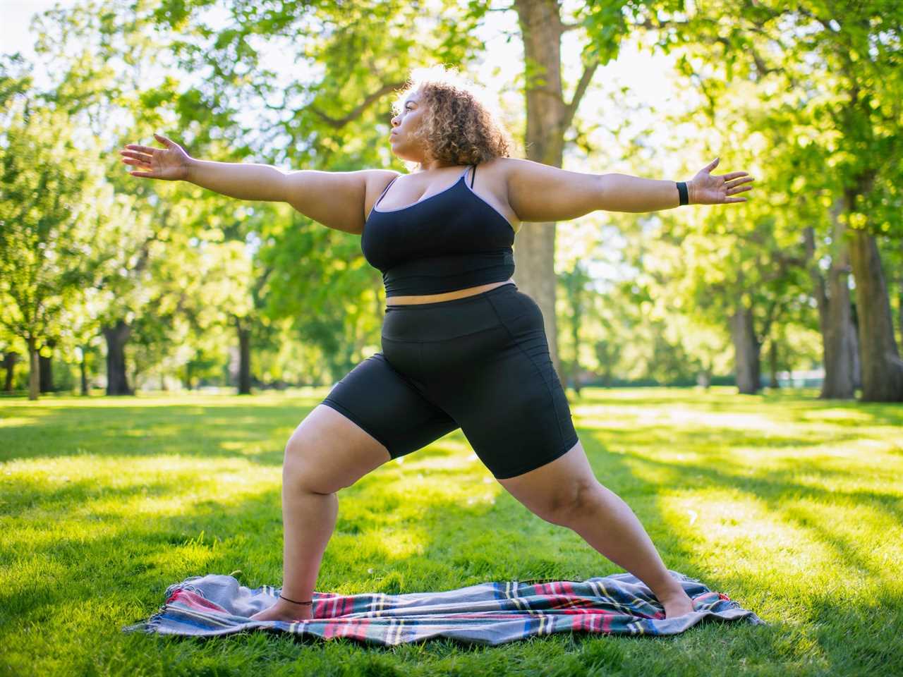 Young woman practicing yoga at a park in Boise, Idaho.