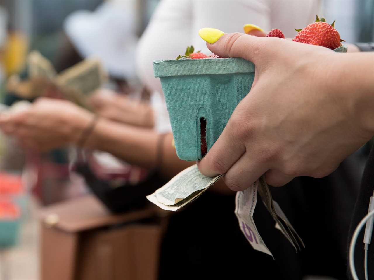 People shop for fruits at the Union Square Farmers Market on July 13, 2022 in New York City.