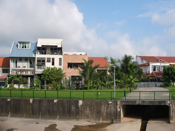 The rear of the house faces a public grassland and canal. 