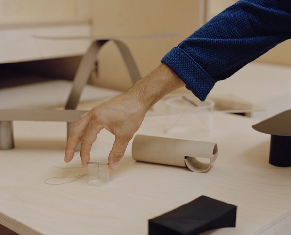 A 1:10 scale model of the To-Tie lamp alongside earlier models of Poletti’s research into using tension constructions in furniture that were developed during his time at the Design Academy Eindhoven. Although completely different in function, the two projects explore similar methods of construction.