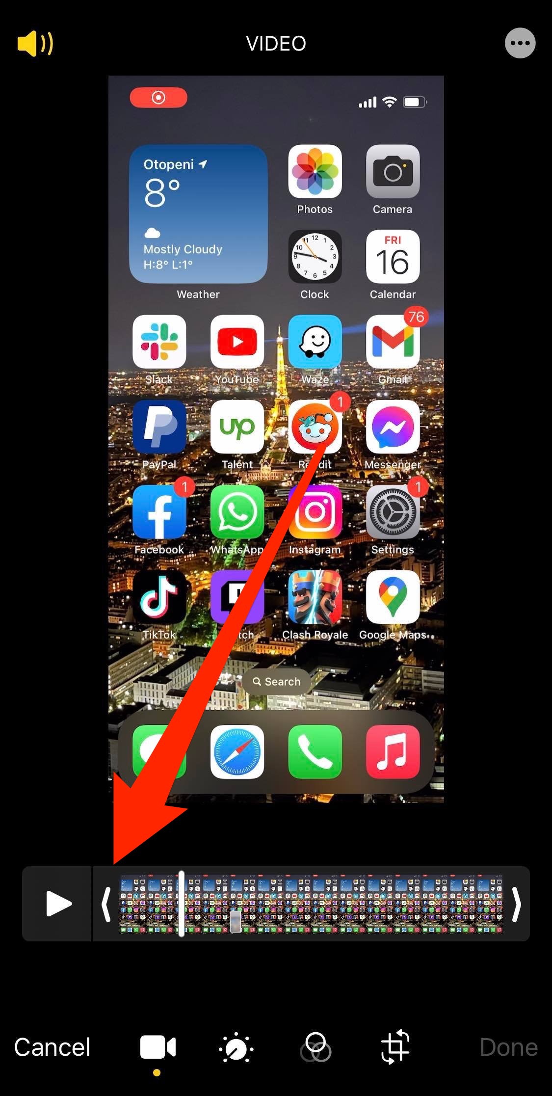 The screen for editing a video in the Photos app, with the arrow at the start of the video in the bottom bar highlighted.