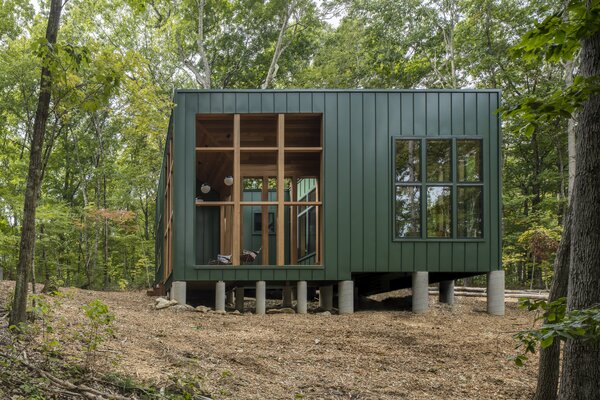 A Metal-Clad Cabin Hovers Above the Forest Floor in Connecticut