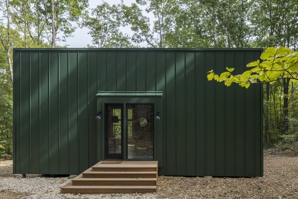 A Metal-Clad Cabin Hovers Above the Forest Floor in Connecticut