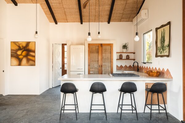 The kitchen now has much more counter space, thanks to the new layout, with a quartz slab Rossi found on 