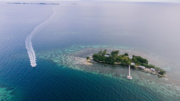 Set behind the Belize Barrier Reef, the private island offers an idyllic spot for snorkeling.