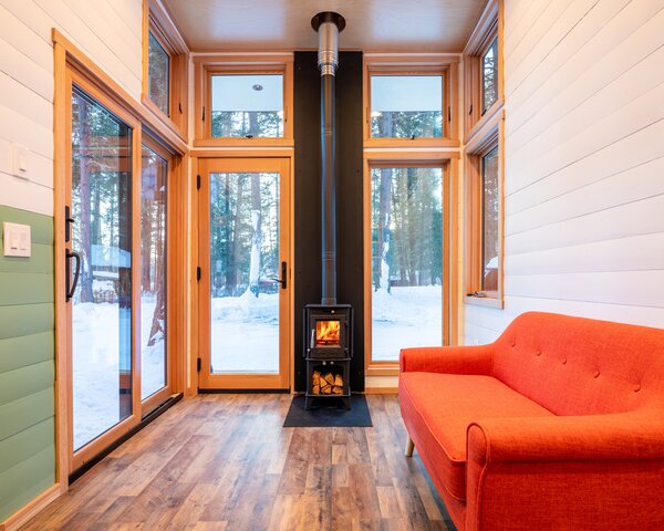 A 4kw tiny wood-burning stove warms each cabin.