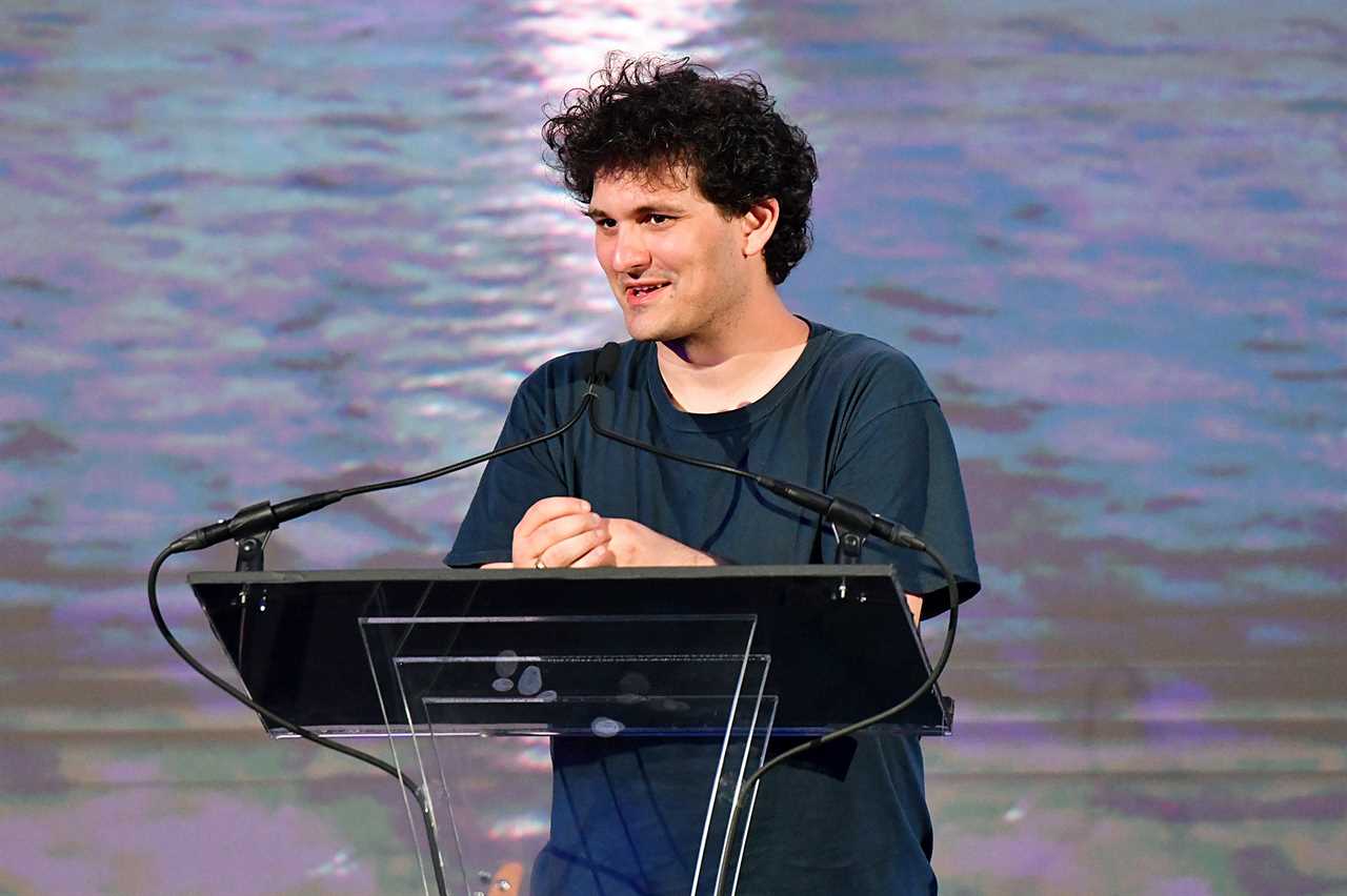 A man stands at a lectern.