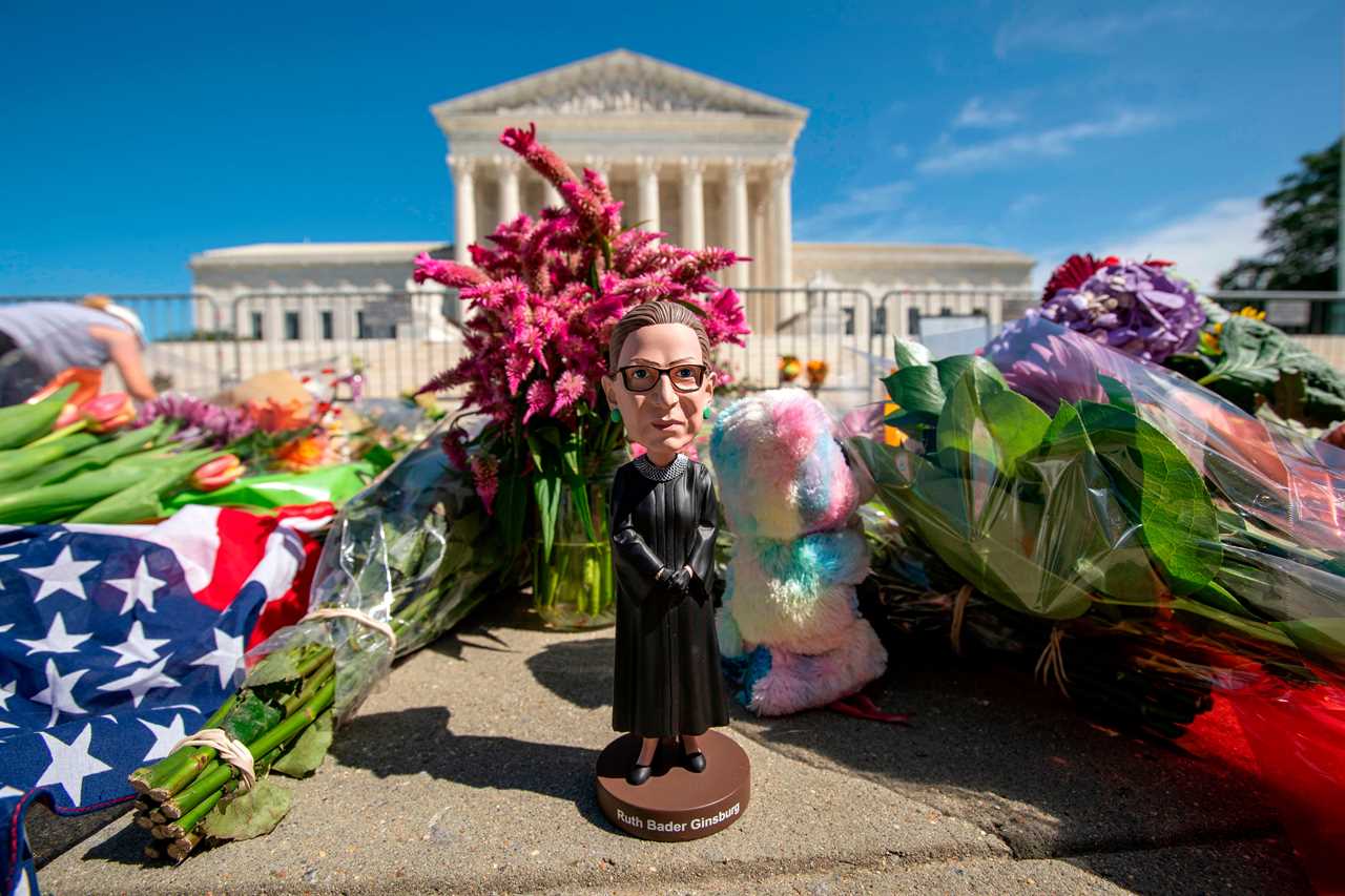 A doll stands in front of the US Supreme Court.