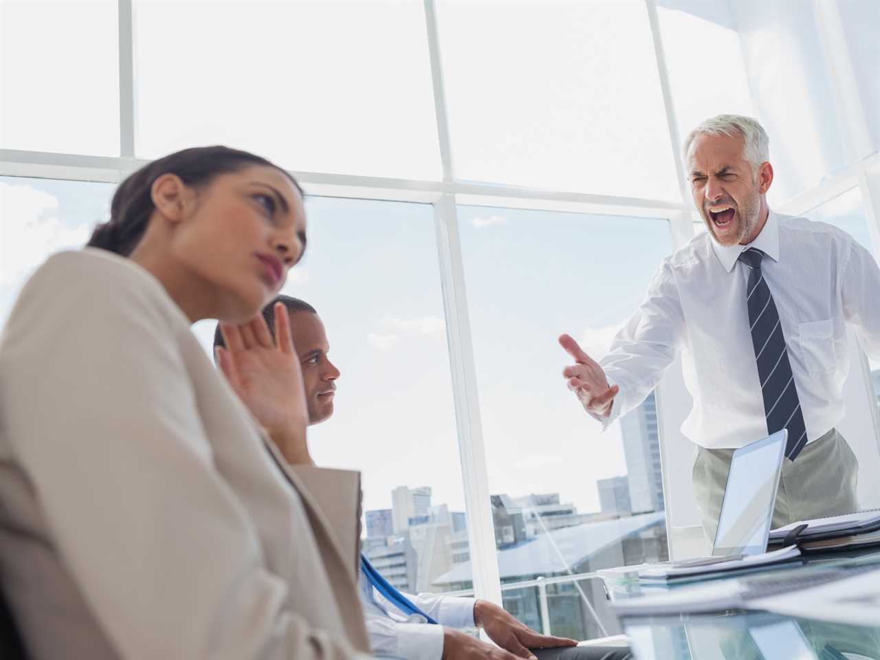 Furious boss yelling at colleagues