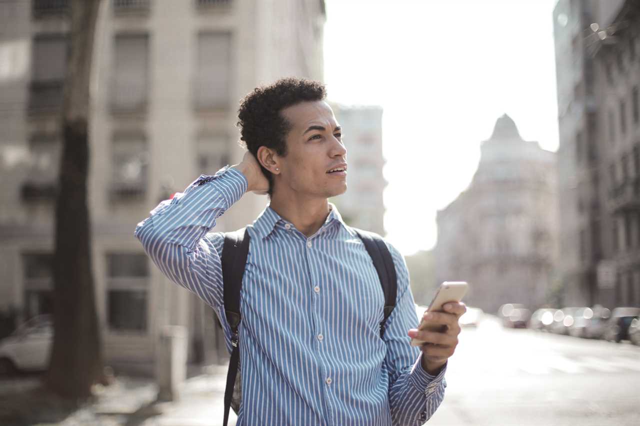 Man using smartphone for directions