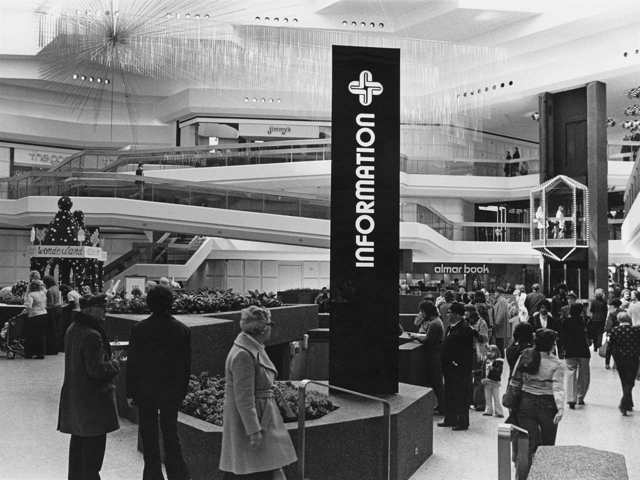 Shoppers walk around in a mall in Chicago in the 1970s