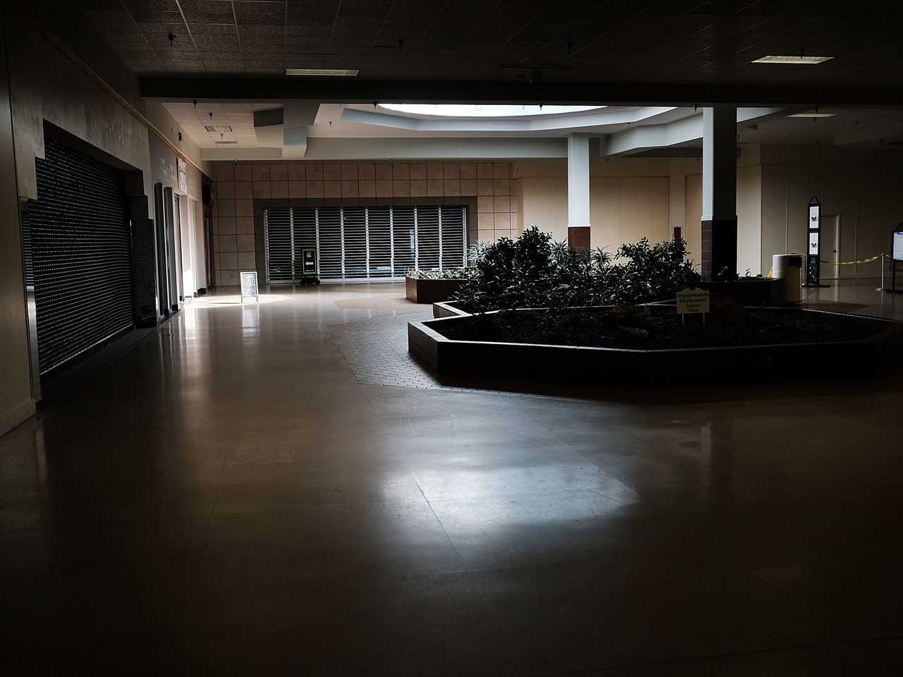 Closed stores inside darkened shopping mall in Pennsylvania in 2017